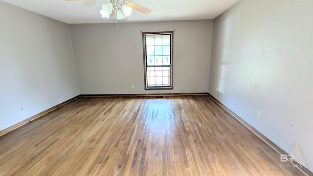 unfurnished room featuring ceiling fan and light hardwood / wood-style flooring