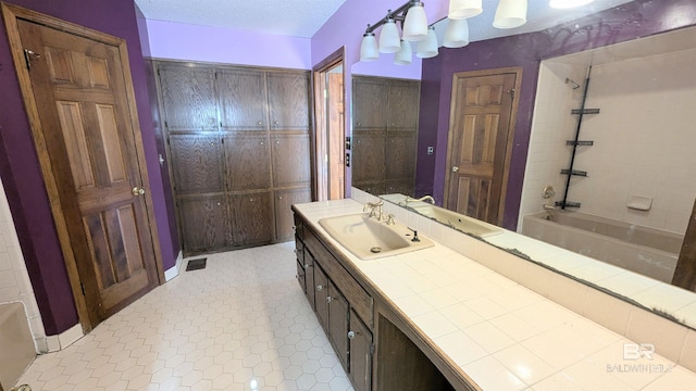 bathroom featuring vanity and bathing tub / shower combination