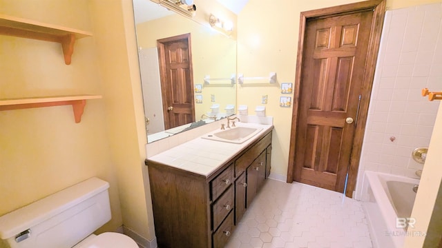 bathroom featuring tile patterned flooring, vanity, and toilet