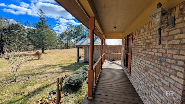 deck featuring a lawn