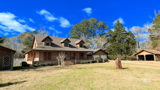 view of front of property with a porch, an outdoor structure, and a front lawn