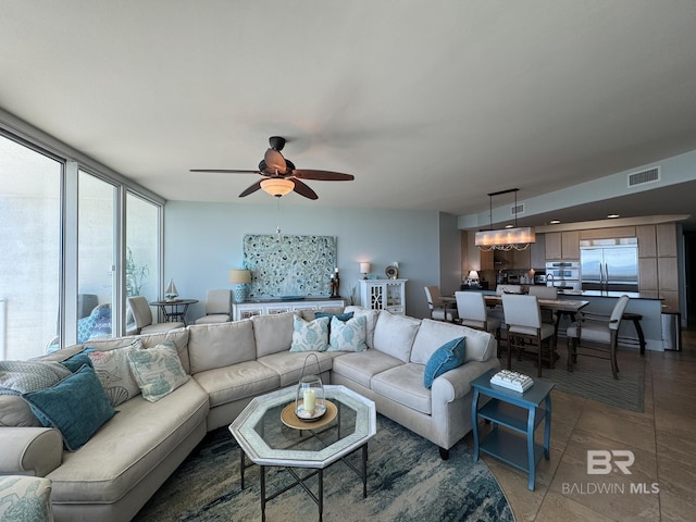 28107 Perdido Beach Blvd Unit D713, Orange Beach, AL 36561 - living area featuring a ceiling fan, light tile patterned floors, and visible vents