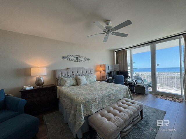 28107 Perdido Beach Blvd Unit D713, Orange Beach, AL 36561 - bedroom with a wall of windows, access to exterior, wood finished floors, and ceiling fan