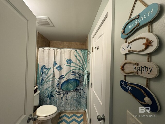 28107 Perdido Beach Blvd Unit D713, Orange Beach, AL 36561 - bathroom featuring toilet, a shower with shower curtain, and visible vents