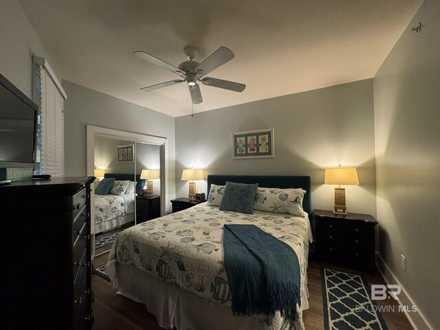 28107 Perdido Beach Blvd Unit D713, Orange Beach, AL 36561 - bedroom featuring a ceiling fan, dark wood-style floors, and baseboards
