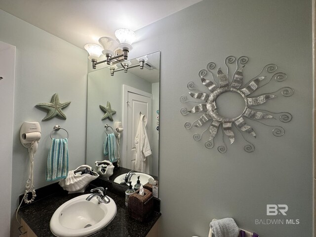 28107 Perdido Beach Blvd Unit D713, Orange Beach, AL 36561 - bathroom featuring an inviting chandelier and vanity