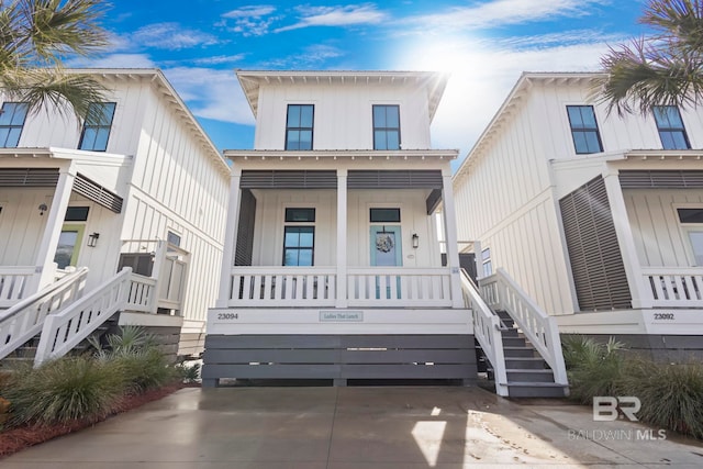 23094 Island Oak Ln Unit 64, Orange Beach, AL 36561 - townhome / multi-family property with a porch