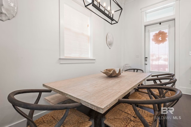 dining space with wood-type flooring