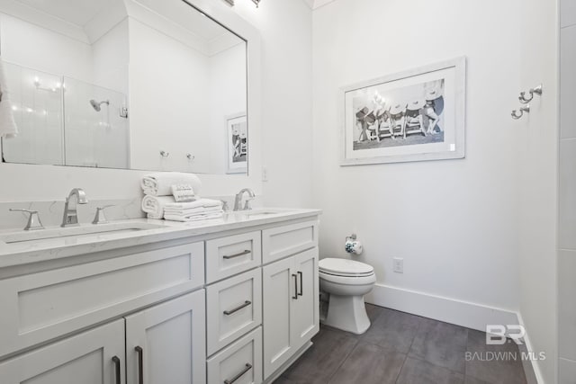 bathroom with vanity, toilet, and walk in shower