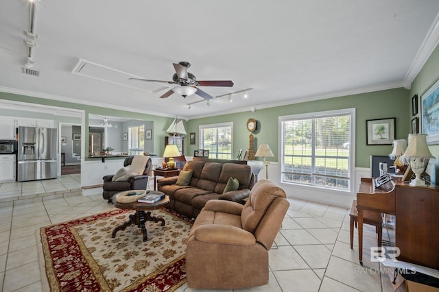 living room featuring rail lighting, ceiling fan, ornamental molding, and light tile patterned flooring