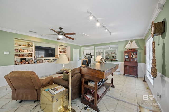 tiled living room with built in shelves, crown molding, and ceiling fan