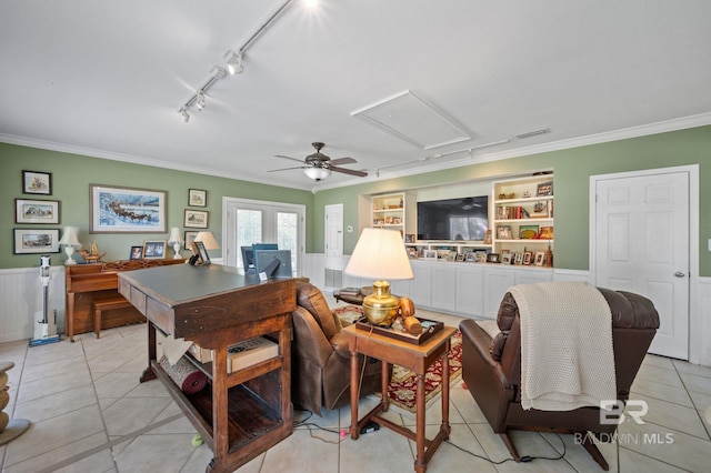 tiled living room with ceiling fan, built in features, ornamental molding, and track lighting