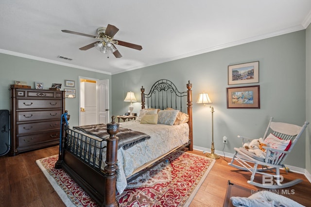 bedroom with ceiling fan, hardwood / wood-style floors, and crown molding