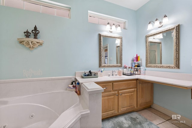10197 Bellingrath Rd, Theodore, AL 36582 - bathroom featuring a jetted tub, tile patterned flooring, and vanity
