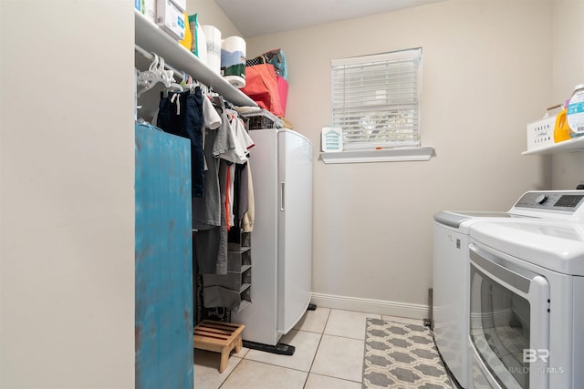 10197 Bellingrath Rd, Theodore, AL 36582 - laundry room featuring washer and clothes dryer and light tile patterned floors