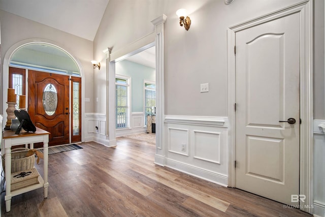 10197 Bellingrath Rd, Theodore, AL 36582 - foyer featuring healthy amount of natural light, a wainscoted wall, a decorative wall, wood finished floors, and lofted ceiling