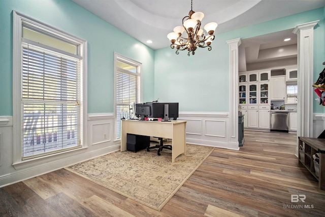 10197 Bellingrath Rd, Theodore, AL 36582 - office space featuring a chandelier, wood finished floors, a raised ceiling, wainscoting, and a decorative wall
