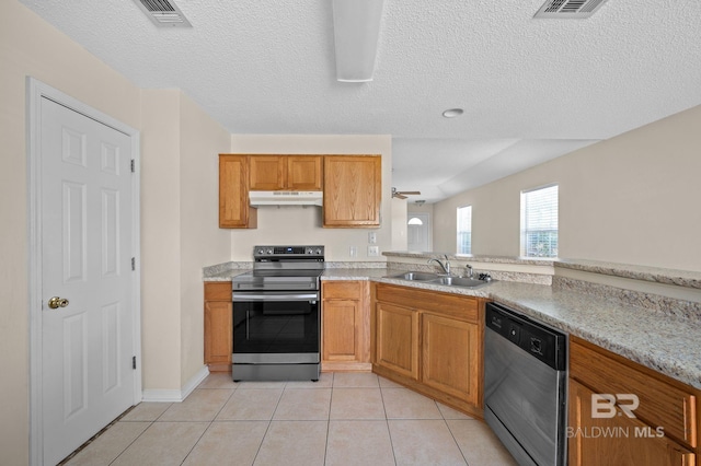 kitchen with sink, ceiling fan, light tile patterned floors, a textured ceiling, and appliances with stainless steel finishes