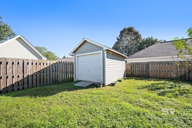 garage featuring a lawn