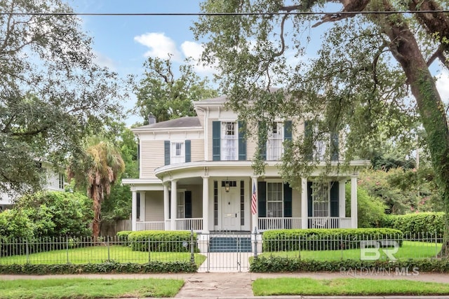 view of front of home featuring a porch and a front yard