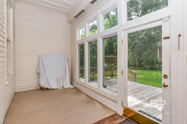 unfurnished sunroom with plenty of natural light