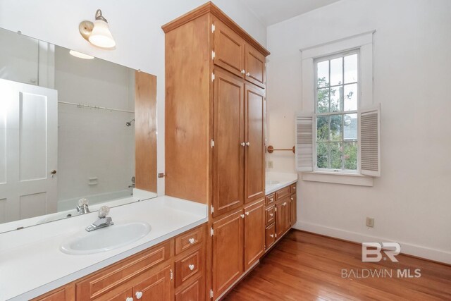 bathroom featuring vanity and hardwood / wood-style flooring