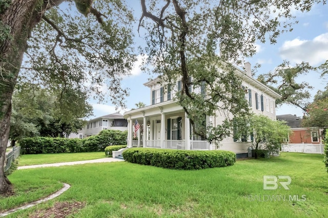 view of side of home featuring a lawn