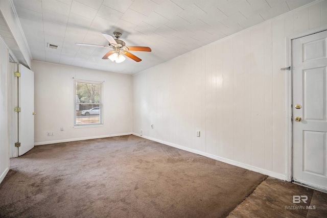 carpeted empty room featuring ceiling fan