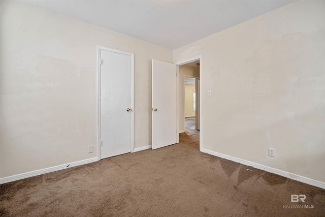 spare room featuring carpet