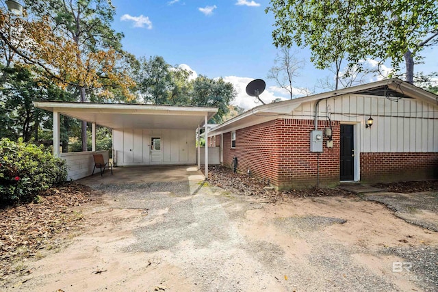 view of property exterior featuring a carport