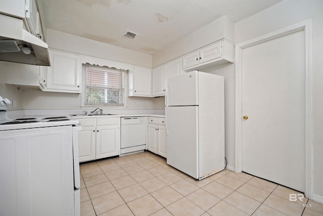 kitchen with sink, white cabinets, white appliances, and light tile patterned floors