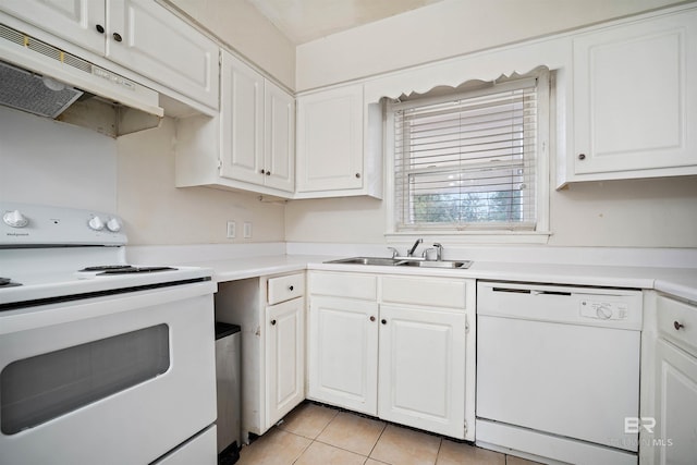 kitchen with sink, white cabinets, light tile patterned flooring, and white appliances