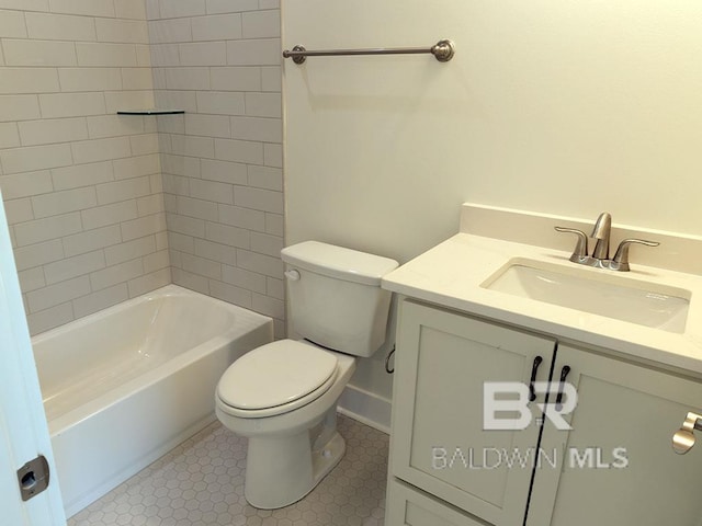 full bathroom with tile patterned flooring, vanity, toilet, and tiled shower / bath