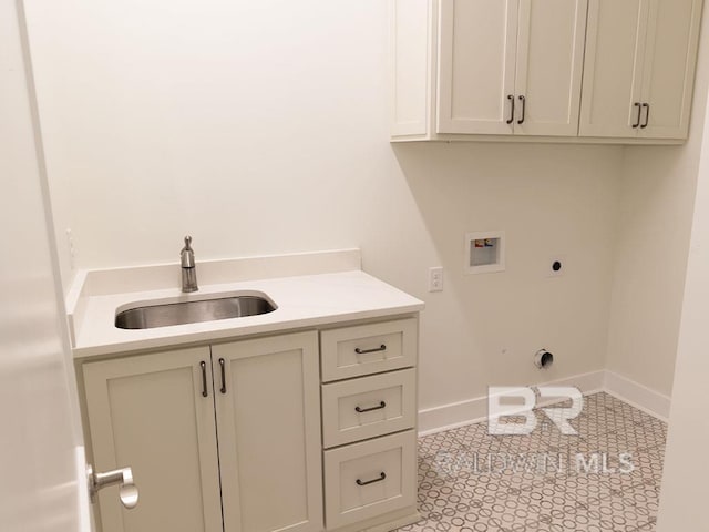 laundry room featuring hookup for an electric dryer, hookup for a washing machine, cabinets, and sink