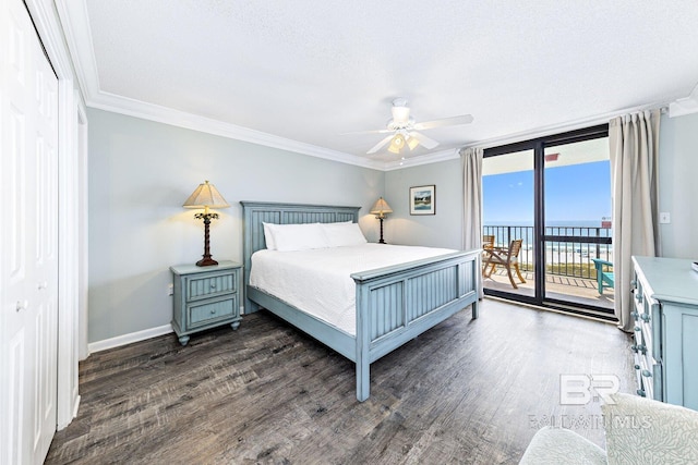 bedroom with crown molding, a water view, access to exterior, and dark wood-style flooring