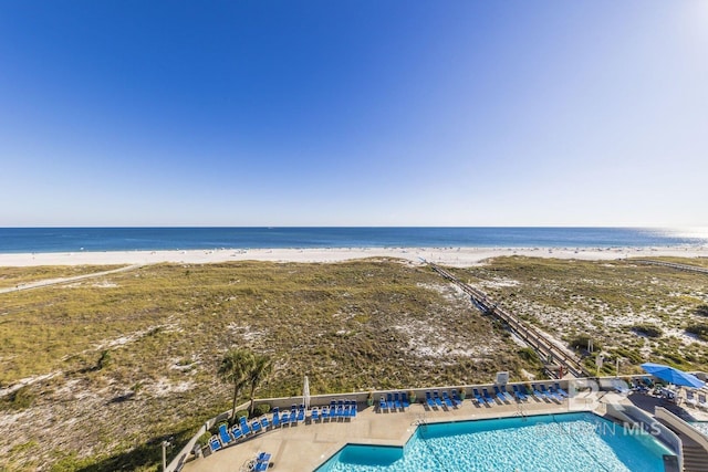 bird's eye view with a water view and a view of the beach