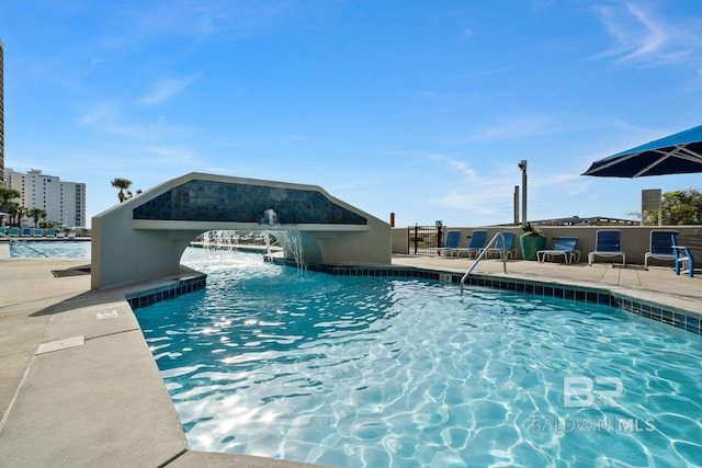 community pool featuring a patio