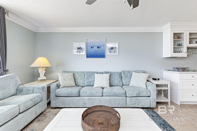 living room with crown molding, a textured ceiling, and ceiling fan