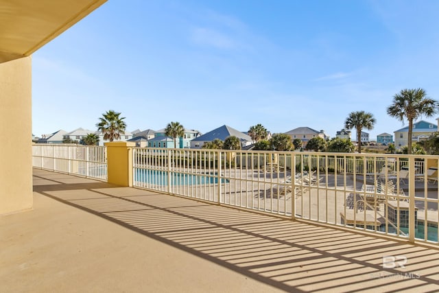 view of patio with a fenced in pool