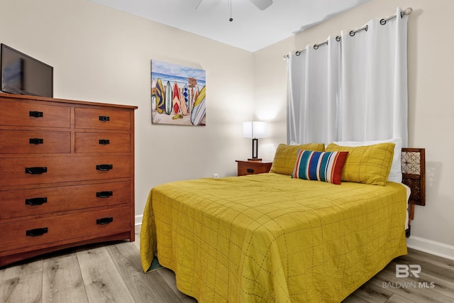 bedroom with ceiling fan and light wood-type flooring