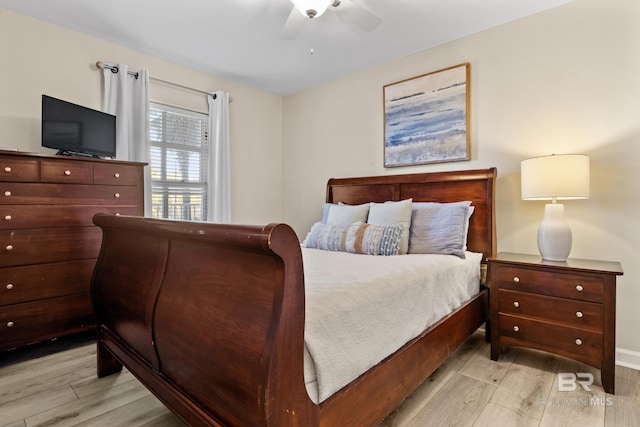 bedroom featuring light hardwood / wood-style floors and ceiling fan