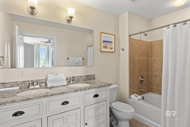 full bathroom featuring vanity, ceiling fan, toilet, and shower / bathtub combination with curtain