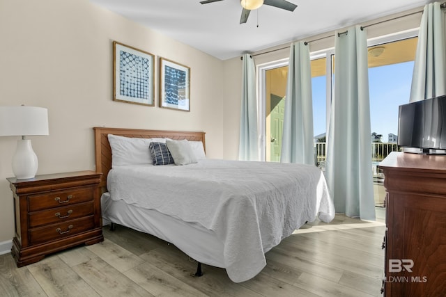 bedroom with access to exterior, light hardwood / wood-style floors, and ceiling fan