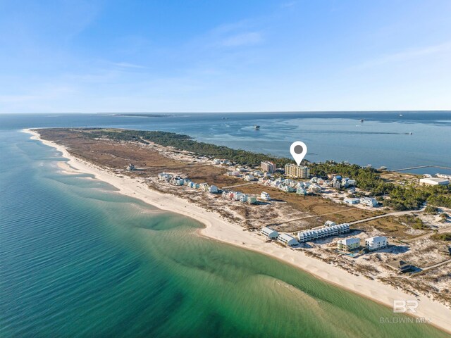 birds eye view of property with a view of the beach and a water view