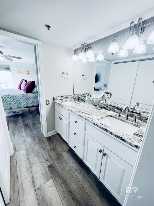 bathroom featuring vanity, hardwood / wood-style floors, and ceiling fan