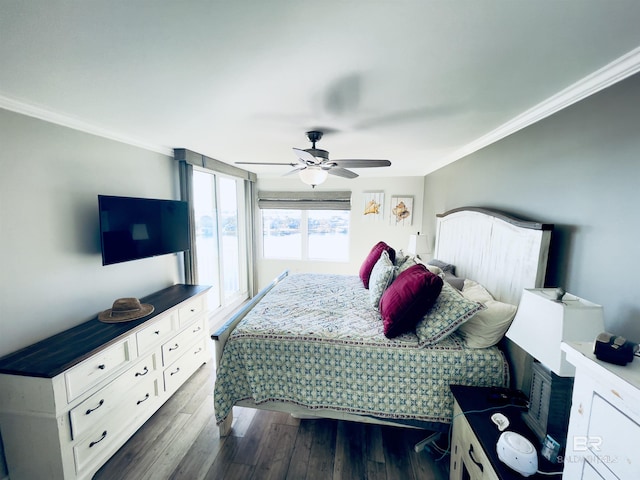 bedroom with ceiling fan, dark wood-type flooring, and crown molding