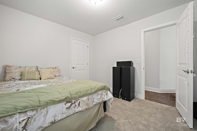 bedroom featuring carpet floors and baseboards