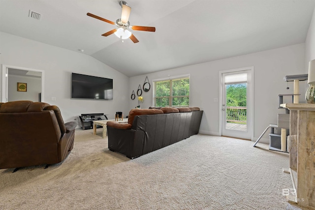 carpeted living room with lofted ceiling, ceiling fan, and baseboards