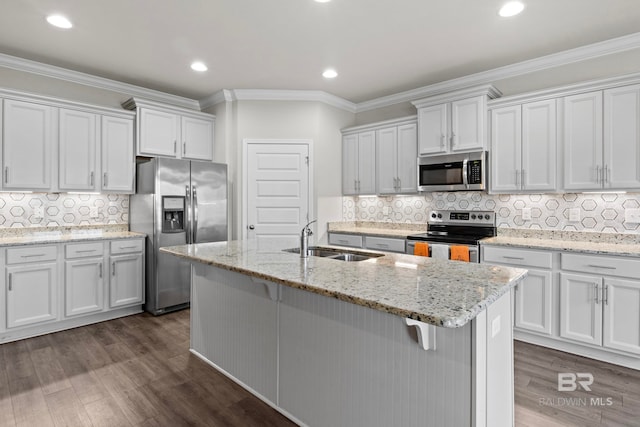 kitchen with white cabinets, dark hardwood / wood-style flooring, sink, and stainless steel appliances