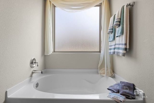 bathroom with a tub